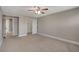 Bright bedroom with ceiling fan and access to a hallway at 11154 Grants Landing Ct, Las Vegas, NV 89141