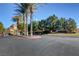 Royal Highlands gated community entrance with palm trees and landscaping at 11154 Grants Landing Ct, Las Vegas, NV 89141