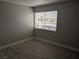 Simple bedroom with wood-look floors and window coverings at 1405 Vegas Valley Dr # 158, Las Vegas, NV 89169