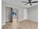 Bedroom featuring tile floors, mirrored closet doors, and ceiling fan at 1575 W Warm Springs Rd # 1612, Henderson, NV 89014