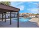 Community pool with covered patio area and surrounding buildings at 1575 W Warm Springs Rd # 1612, Henderson, NV 89014