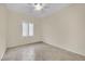 Spare bedroom with tiled floor and ceiling fan at 2210 Bensley St, Henderson, NV 89044