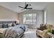 Main bedroom with large window, ceiling fan, and a sitting area at 2259 Galindo Ct, Henderson, NV 89052