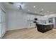 Modern kitchen with an island, white cabinets, and stainless steel appliances at 2518 Starlight Valley St, Henderson, NV 89044