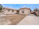 Single-story house with a two-car garage and a small front yard at 3111 Johannan Ln, North Las Vegas, NV 89032