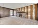 Living room with brick fireplace and wood paneling at 3809 San Bernardino Ave, Las Vegas, NV 89102