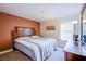 Spacious bedroom with a king-size bed and wood furniture at 4200 S Valley View Blvd # 3030, Las Vegas, NV 89103