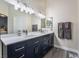 Bathroom with double vanity and a large mirror at 4318 Red Blanket Rd, North Las Vegas, NV 89032