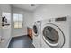 Laundry room features washer, dryer, and a utility sink at 445 Venticello Dr, Las Vegas, NV 89138