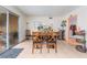 Dining area with a wood table and chairs near sliding glass doors at 4765 Marlboro Ct, Las Vegas, NV 89147