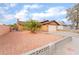 Single-story house with a two-car garage and a landscaped front yard at 4765 Marlboro Ct, Las Vegas, NV 89147