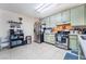 Bright kitchen featuring stainless steel appliances and light green cabinetry at 4765 Marlboro Ct, Las Vegas, NV 89147