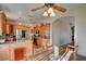 Spacious kitchen with an island, wood cabinets, and tile floor at 4890 Willis St, North Las Vegas, NV 89031