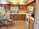 Light oak kitchen with white appliances at 5438 Cholla Cactus Ave, Las Vegas, NV 89141