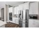 Modern kitchen with stainless steel appliances and white cabinets at 5523 Taylor Rose Ave, Las Vegas, NV 89139