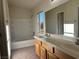 Bathroom with double vanity, bathtub, and window at 6624 Lavender Lilly Ln # 1, North Las Vegas, NV 89084