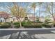 Beautiful two-story home with a manicured lawn and mature trees at 7501 Bachelors Button Dr, Las Vegas, NV 89131