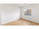 Well-lit bedroom featuring wood flooring and a window at 7936 Pinnochio Ave, Las Vegas, NV 89131