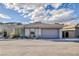 Contemporary home with attached garage and desert landscaping at 889 Adair Grove Ln, Las Vegas, NV 89138