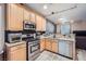 Updated kitchen featuring stainless steel appliances and wood cabinetry at 9790 Overlook Ridge Ave, Las Vegas, NV 89148