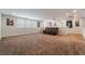 Spacious loft area with a brown leather couch and wall art at 1025 Bluebird Hill Ave, North Las Vegas, NV 89084