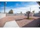 Backyard view with gravel, shed, and block wall at 1208 Clairemont St, Las Vegas, NV 89110