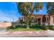 Front view of a two-story building with landscaping and a tree at 1317 E St Louis Ave # A, Las Vegas, NV 89104