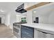 Modern kitchen with stainless steel appliances and white and navy blue cabinetry at 1501 Strong Dr, Las Vegas, NV 89102