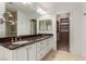 Bathroom with granite countertops, double sinks, and a large walk-in shower at 1605 Shadow Rock Dr, Las Vegas, NV 89117