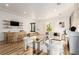 Home bar with stonework, seating, and wood shelving at 2108 Grand Island Ct, Las Vegas, NV 89117