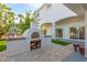 Outdoor brick pizza oven with wood and tile details at 2108 Grand Island Ct, Las Vegas, NV 89117