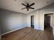 Spacious bedroom with ceiling fan and wood-look flooring at 2570 Velez Valley Way, Henderson, NV 89002