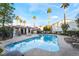 Community pool with surrounding patio and lounge chairs at 2615 W Gary Ave # 2048, Las Vegas, NV 89123