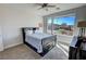 Bedroom with a dark brown bed frame and large window at 4717 S Maddington Ct, Pahrump, NV 89061