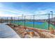 Two well-maintained tennis courts with chain-link fencing at 4717 S Maddington Ct, Pahrump, NV 89061