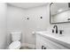 Small bathroom with white vanity, quartz countertop, and black fixtures at 491 Kristin Ln, Henderson, NV 89011