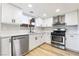 Modern kitchen with white shaker cabinets and quartz counters at 491 Kristin Ln, Henderson, NV 89011