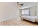 Bright bedroom with light wood floors and ceiling fan at 510 Rafkin Pl, Henderson, NV 89052