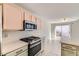 Modern kitchen with stainless steel appliances and island at 510 Rafkin Pl, Henderson, NV 89052