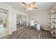 Home office with wood-look floors, desk, and built-in shelving at 520 Belville Rd, Pahrump, NV 89048