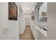 Bright hallway with wood flooring and decorative wall art at 5320 Rebecca Rd, Las Vegas, NV 89130