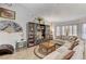 Bright living room featuring a comfortable sectional sofa and decorative shelving at 5320 Rebecca Rd, Las Vegas, NV 89130