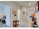 Bright hallway with light gray walls and tile flooring at 5862 Steinbeck Valley St, Las Vegas, NV 89113