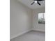 Bright bedroom with ceiling fan and neutral gray carpet at 6009 Silvalde Ln, Las Vegas, NV 89135