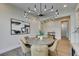 Modern dining room with round table and stylish chandelier at 6009 Silvalde Ln, Las Vegas, NV 89135