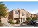 Two-story house with a two-car garage, landscaping, and a blue car parked in front at 6122 Walker Valley Ct, Las Vegas, NV 89139