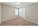 Cozy bedroom with neutral walls and carpet at 6138 Villa Lante Ave, Las Vegas, NV 89113