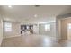 Open living room with wood-look floors and recessed lighting at 6138 Villa Lante Ave, Las Vegas, NV 89113