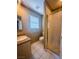 Simple bathroom with granite vanity and shower at 6365 Black Swan Ln, Las Vegas, NV 89118