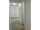 Clean and bright hallway with tile flooring and neutral walls at 6529 Bourbon Way, Las Vegas, NV 89107